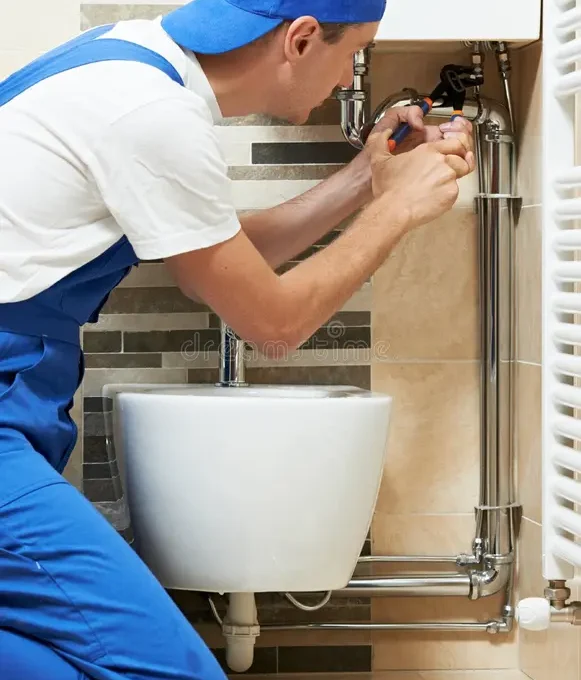 young-plumber-man-worker-working-spanner-sanitary-washbasin-installation-system-32352074 young-plumber-man-worker-working-spanner-sanitary-washbasin-installation-system-32352074